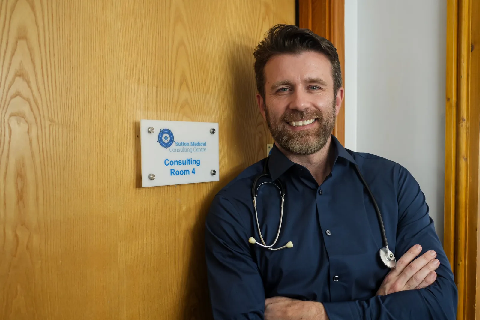 Dr Dan Reardon outside a consulting room at Sutton Medical Consulting
