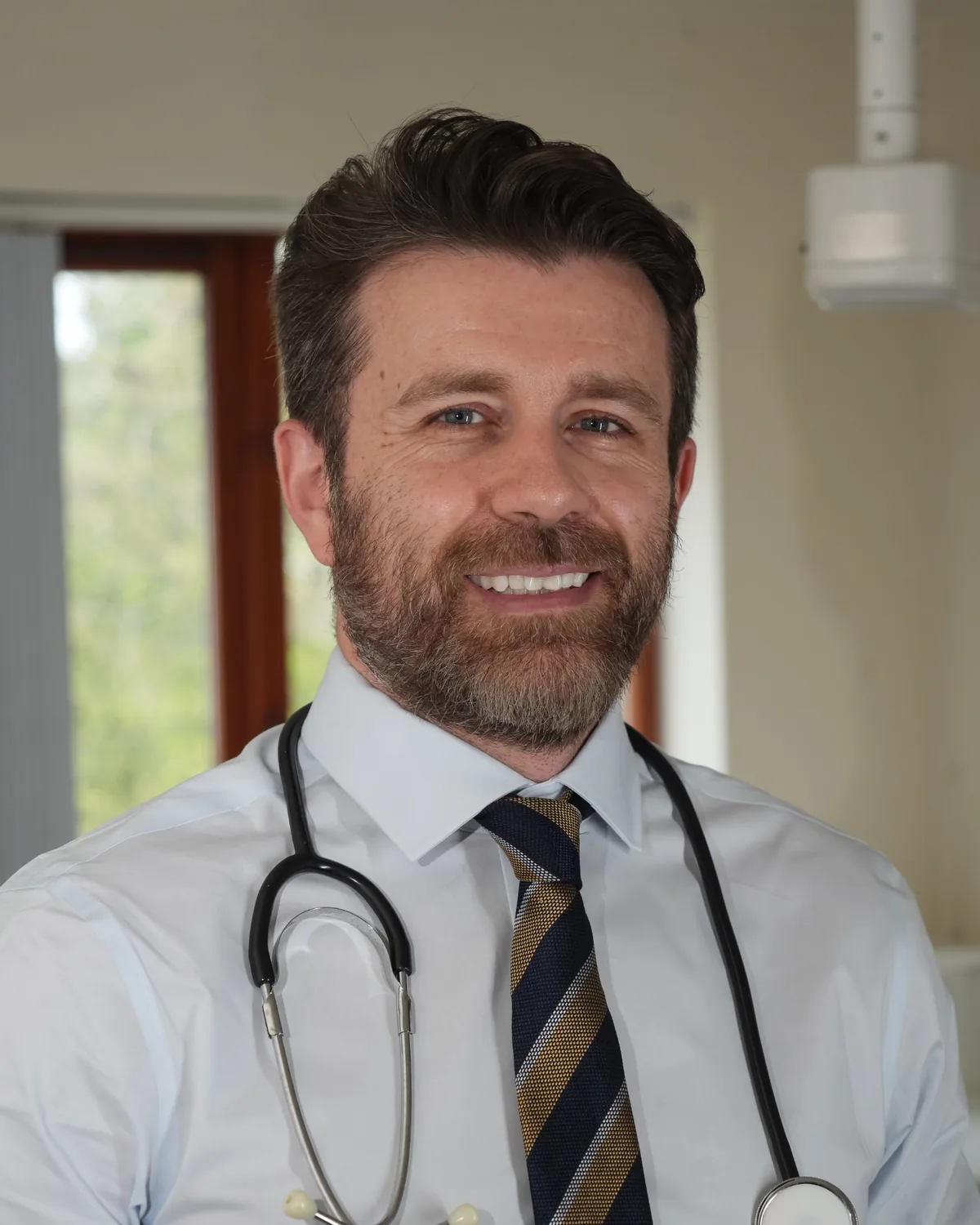 Dr Dan Reardon in his consulting room
